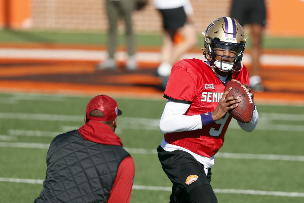 National quarterback Michael Penix Jr., of Washington, runs drills during practice for the Seni ...