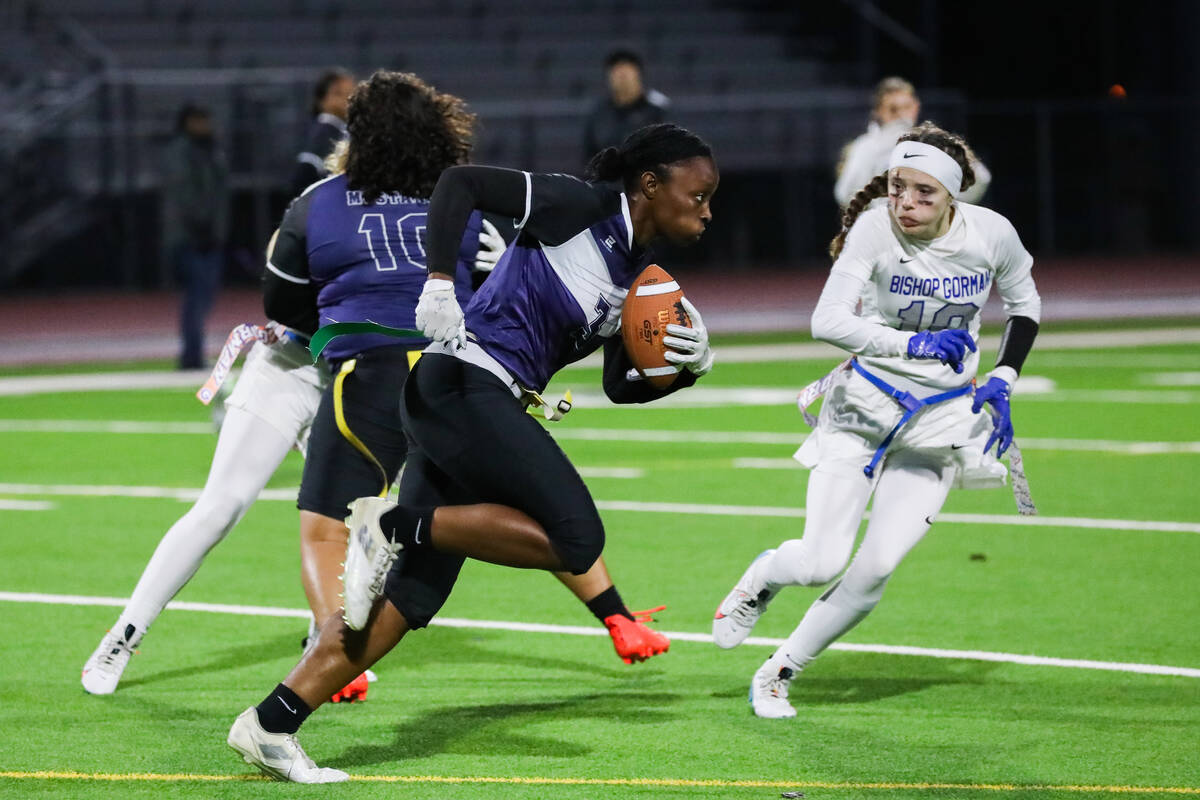 Shadow Ridge’s Kyla Moore (3) charges down the field while Bishop Gorman’s Brie W ...