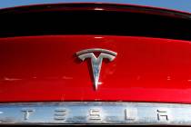 In this Feb. 2, 2020, file photo, the Tesla company logo is shown in Littleton, Colo. Tesla is ...