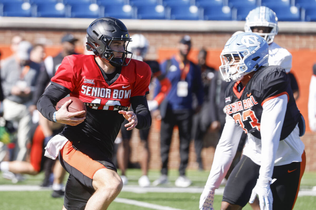 National quarterback Bo Nix of Oregon (10) runs through drills during practice for the Senior B ...