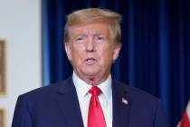 Former President Donald Trump speaks to the media at a Washington hotel, Tuesday, Jan. 9, 2024, ...