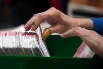 Election workers process ballots at the Clark County Election Department, Thursday, Nov. 10, 20 ...