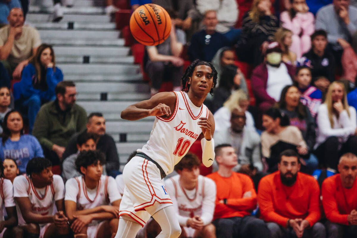 Bishop Gorman point guard Nick Jefferson (10) passes the ball to a teammate during a game betwe ...