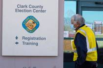 FILE - A security guard walks outside of the Clark County Election Center on Wednesday, Nov. 4, ...
