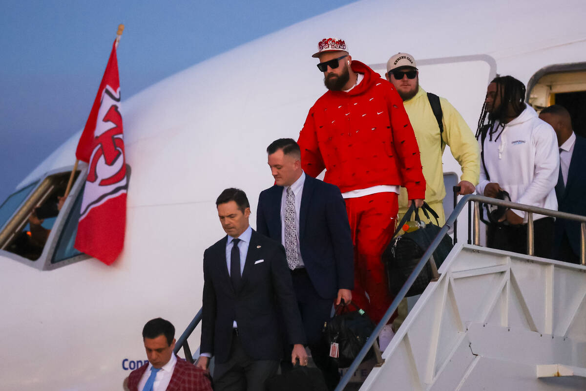 Kansas City Chiefs tight end Travis Kelce arrives at the Harry Reid International Airport along ...
