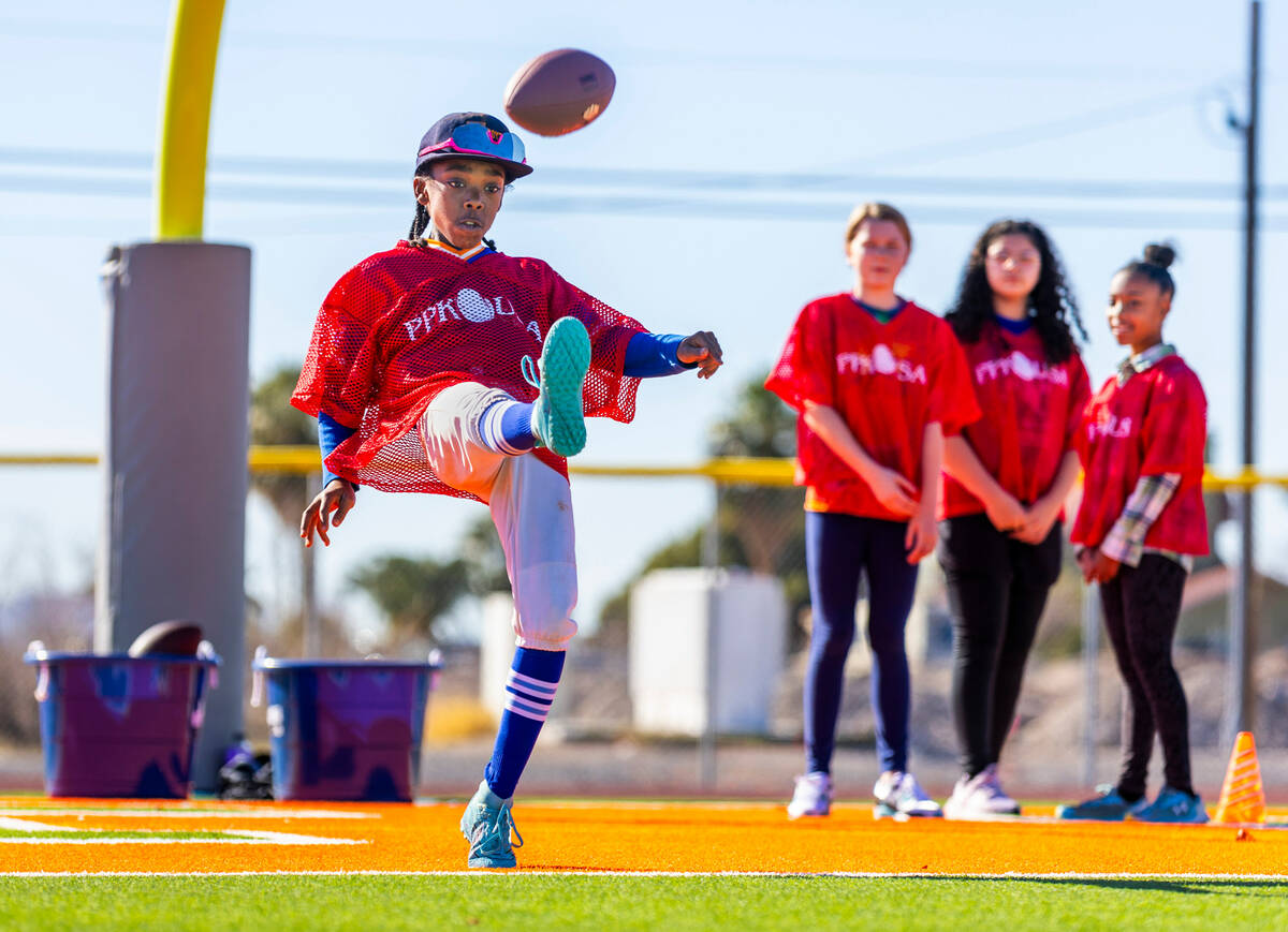 Gerald Owens III of Las Vegas, a 10/11-year-old boy's contestant, punts the ball during the Pun ...