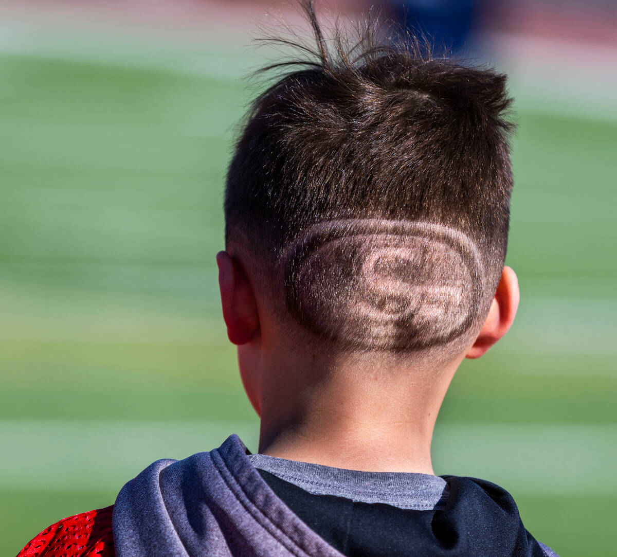 Kanin Johnson of Conrad, Montana, a 6/7-year-old boy's contestant, sports a San Francisco 49ers ...