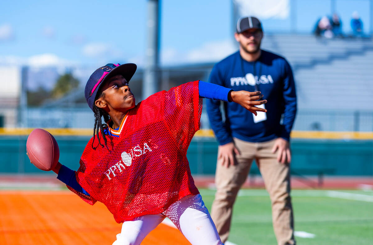 Gerald Owens III of Las Vegas, a 10/11-year-old boy's contestant, throws the ball during the Pu ...