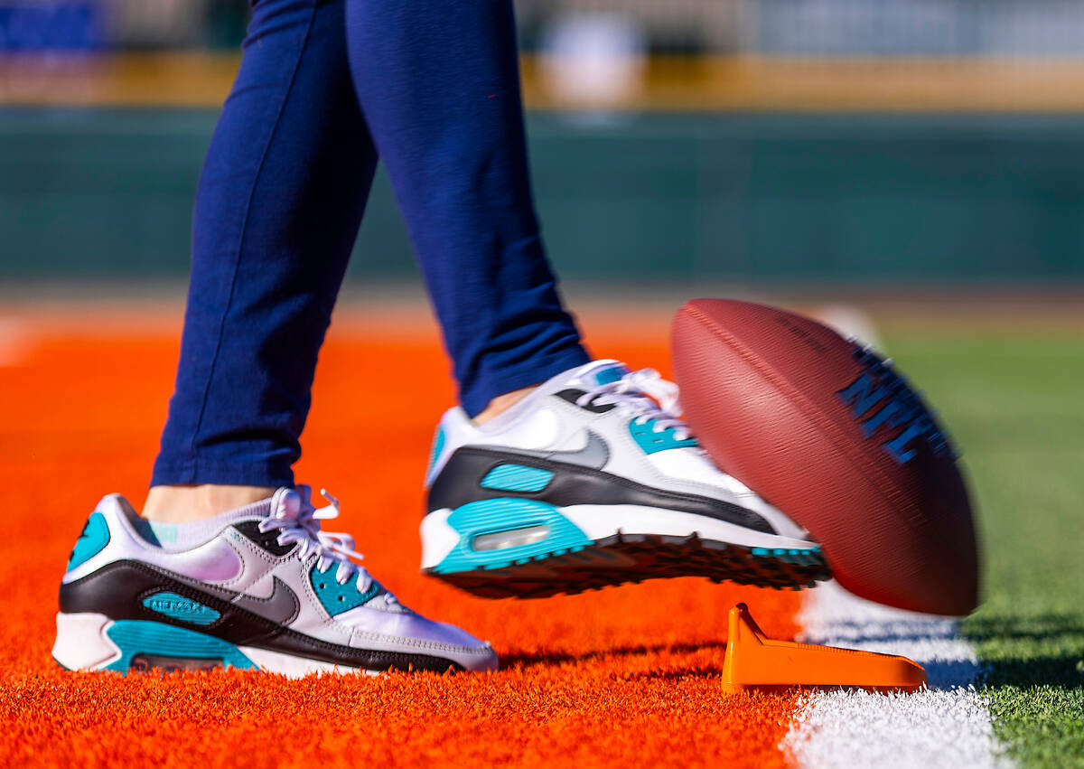 A 10/11-year-old girl's contestant kicks the ball during the Punt, Pass and Kick National Final ...