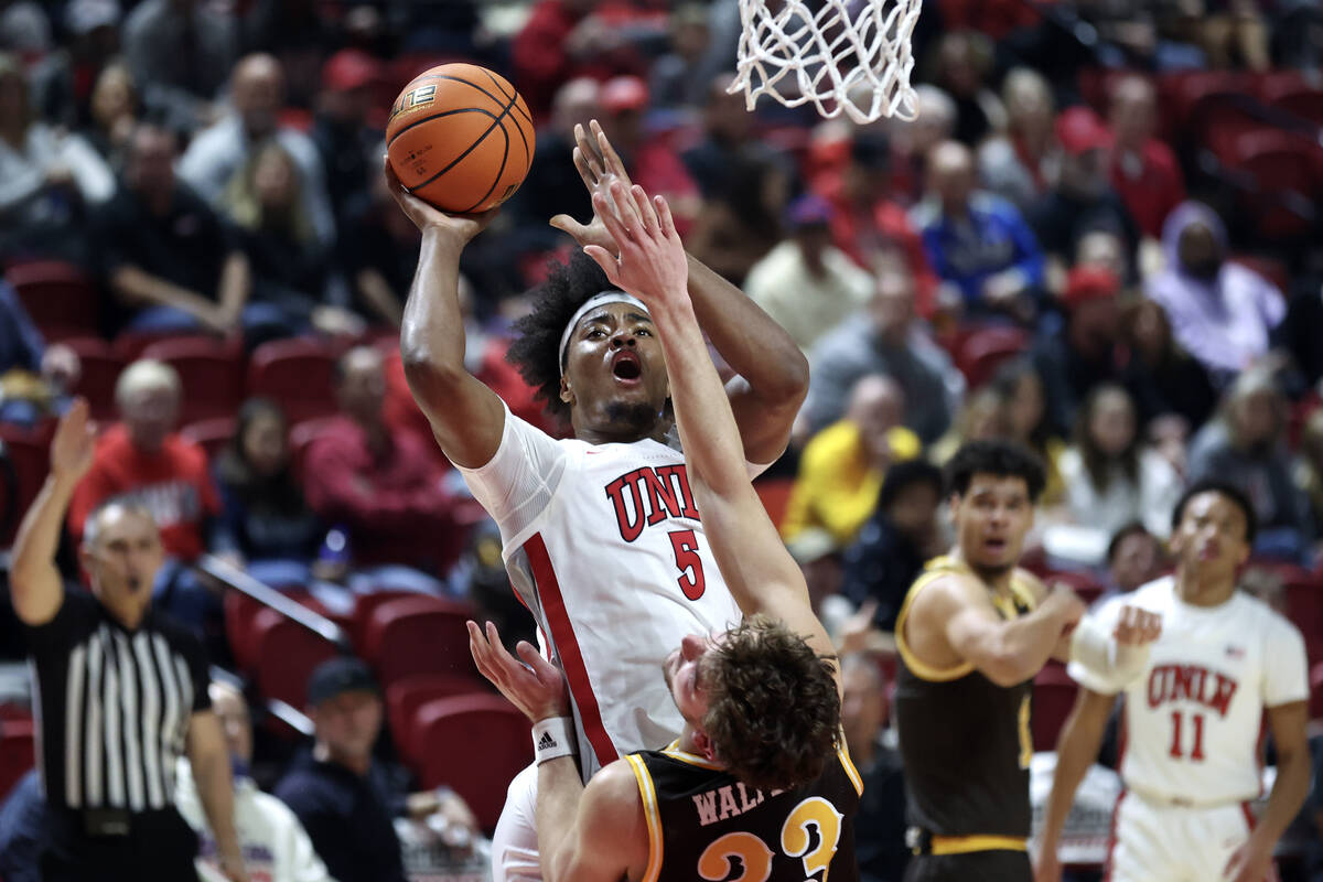 UNLV Rebels forward Rob Whaley Jr. (5) shoots against Wyoming Cowboys forward Mason Walters (33 ...