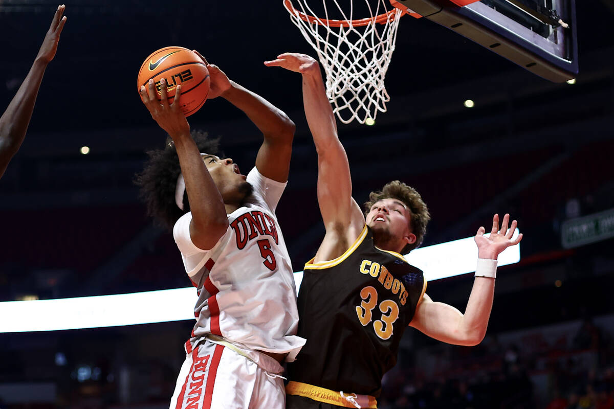 UNLV Rebels forward Rob Whaley Jr. (5) shoots against Wyoming Cowboys forward Mason Walters (33 ...