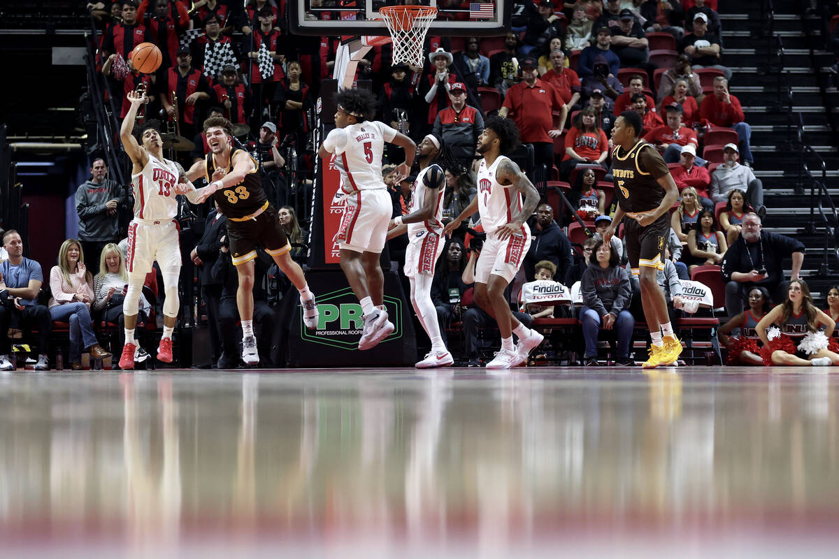 UNLV Rebels guard Brooklyn Hicks (13) steals the ball from Wyoming Cowboys forward Mason Walter ...