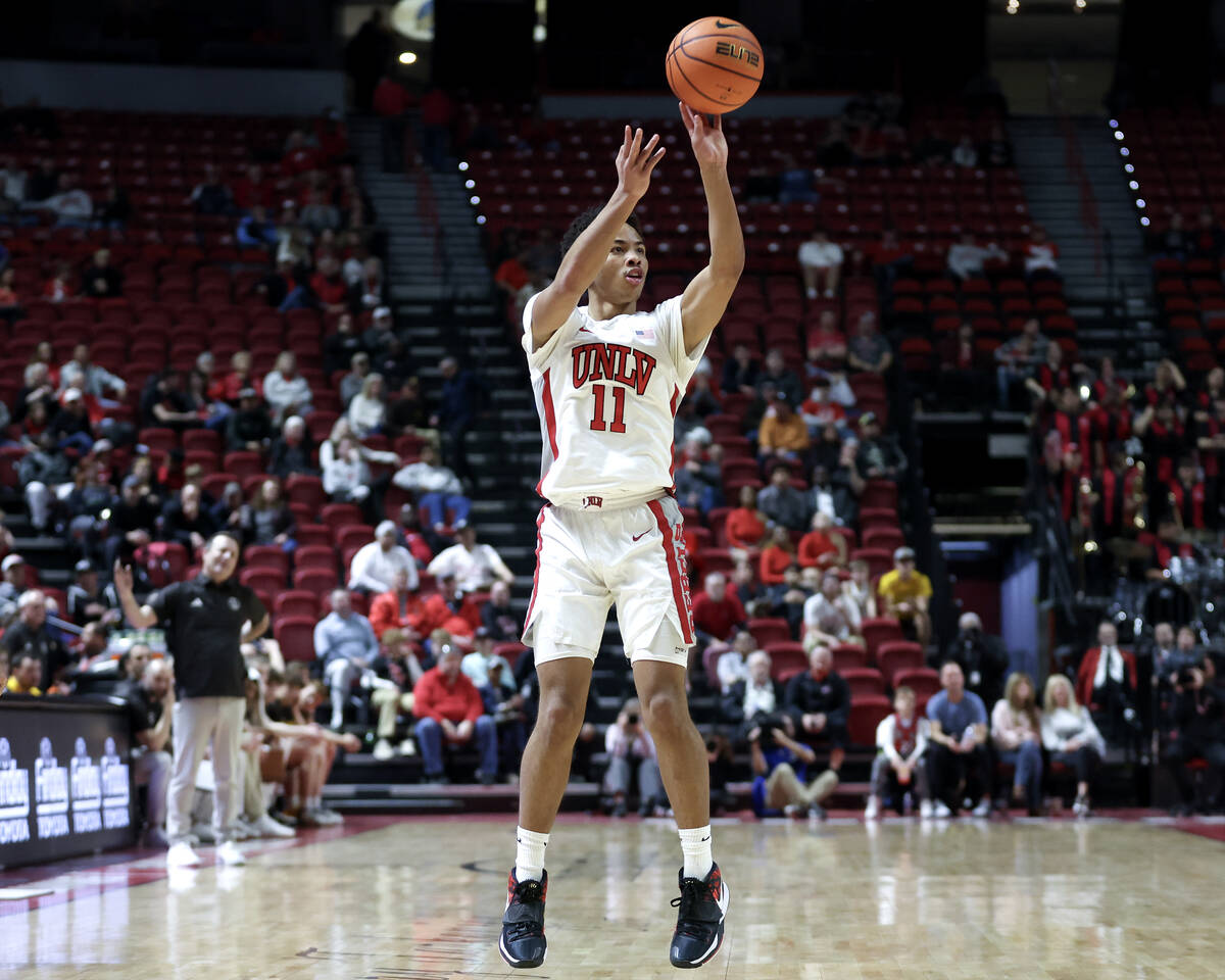 UNLV Rebels guard Dedan Thomas Jr. (11) shoots a three-pointer during the second half of an NCA ...