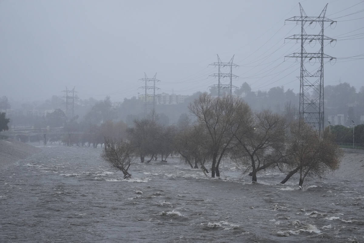 The Los Angeles River carries increased stormwater flow due to the atmospheric rivers affecting ...