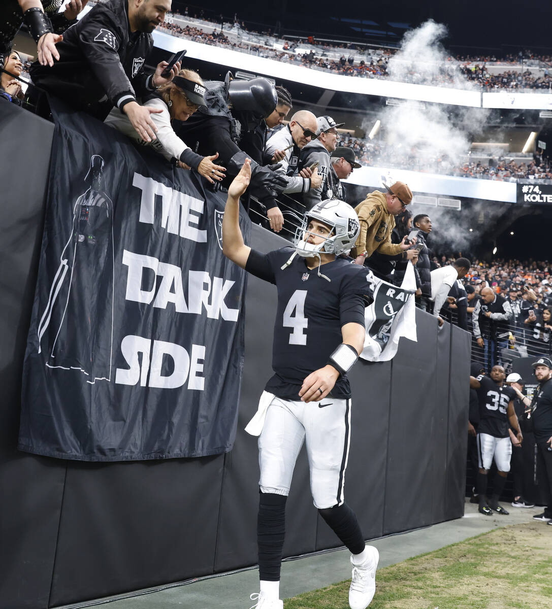Raiders quarterback Aidan O'Connell (4) takes the field to face the Denver Broncos during an NF ...