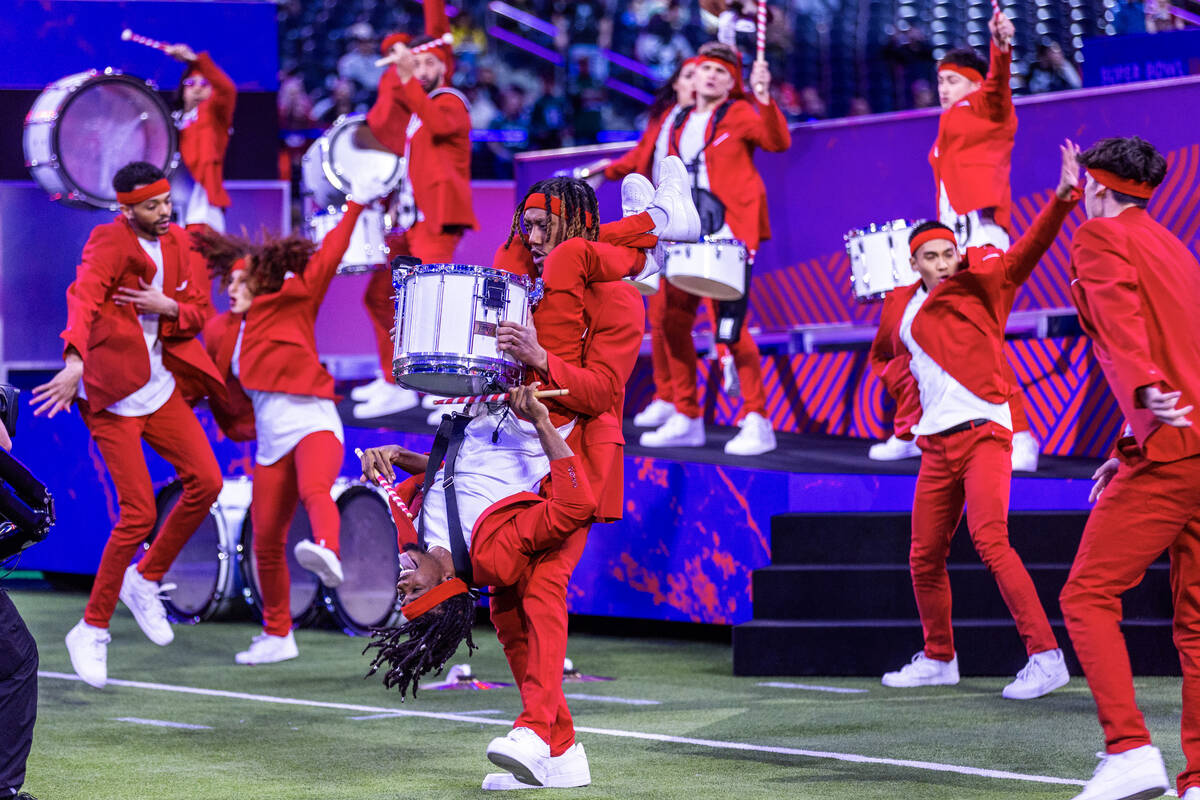 A drum group performs to warm up the crowd during the Super Bowl Opening Night celebration at A ...