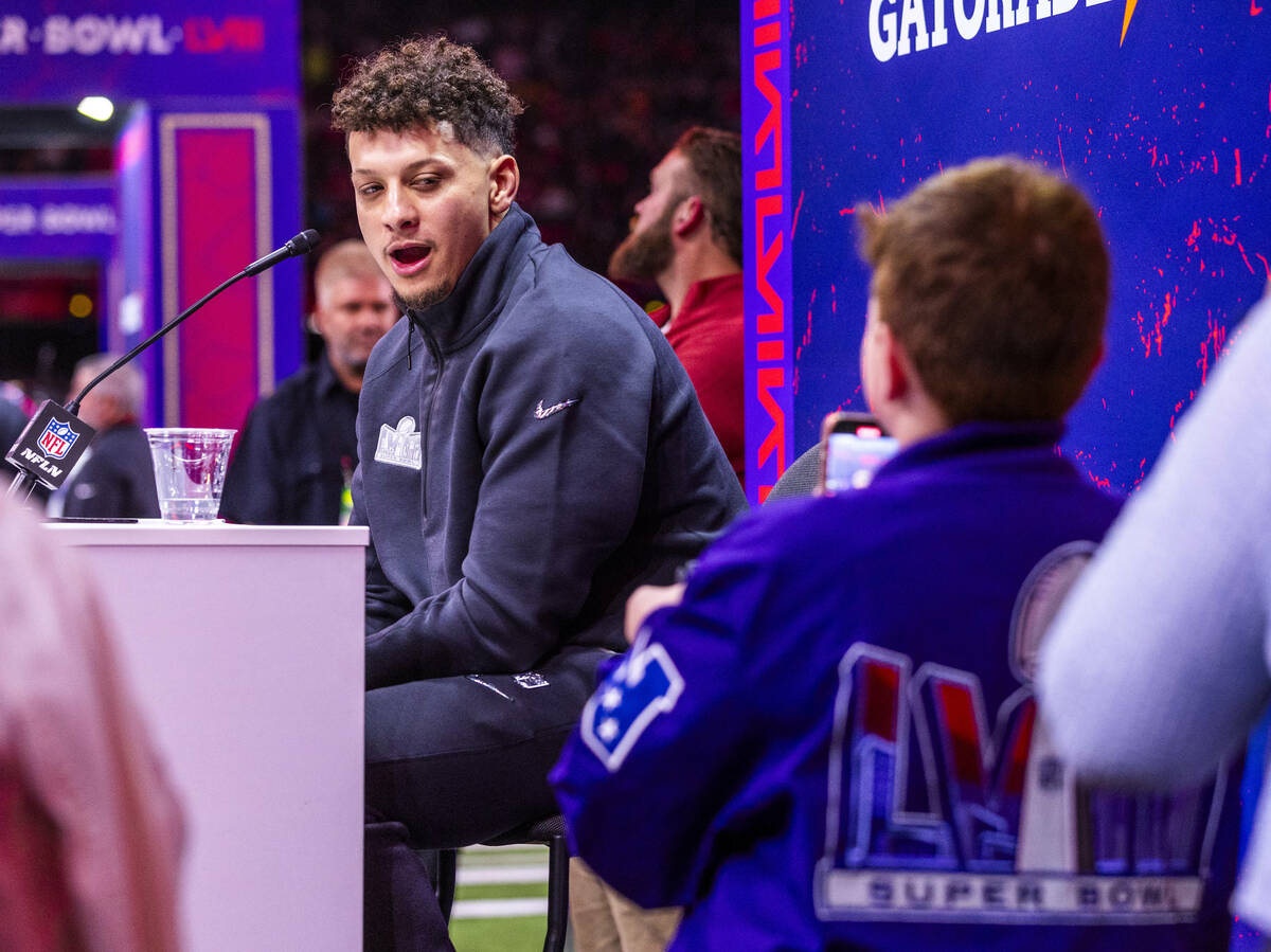Kansas City Chiefs player Patrick Mahomes answers a young media member's question on the field ...