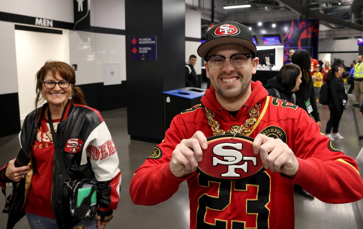 San Francisco 49ers fans Joseph Smith, and his aunt Carrie Post, both of Las Vegas, show their ...