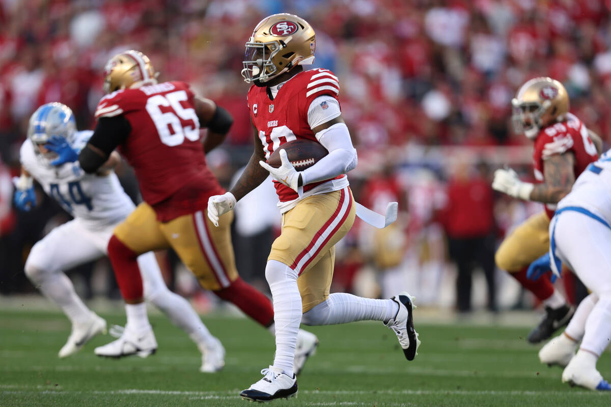 San Francisco 49ers' Deebo Samuel runs against the Detroit Lions during the second half of the ...