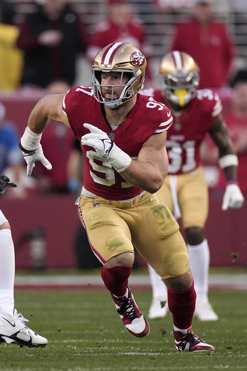 San Francisco 49ers defensive end Nick Bosa rushes toward the ball during the first half of the ...