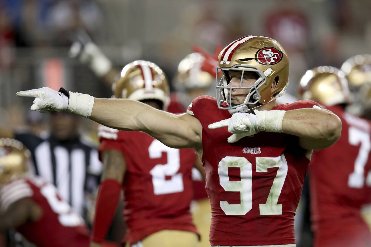 San Francisco 49ers defensive end Nick Bosa (97) reacts after a turnover during the NFC Champio ...