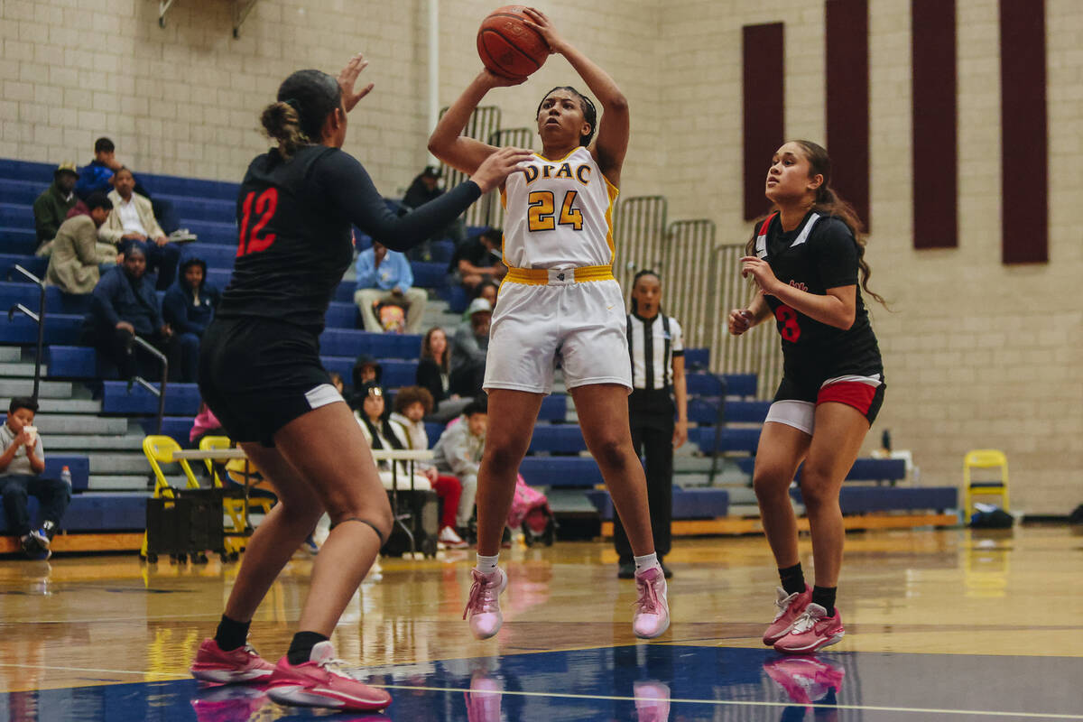 Democracy Prep’s Demi Thompson Lopez (24) attempts a jump shot during a basketball game ...