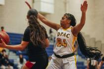 Democracy Prep’s Demi Thompson Lopez (24) puts her hands up as she plays defense during ...