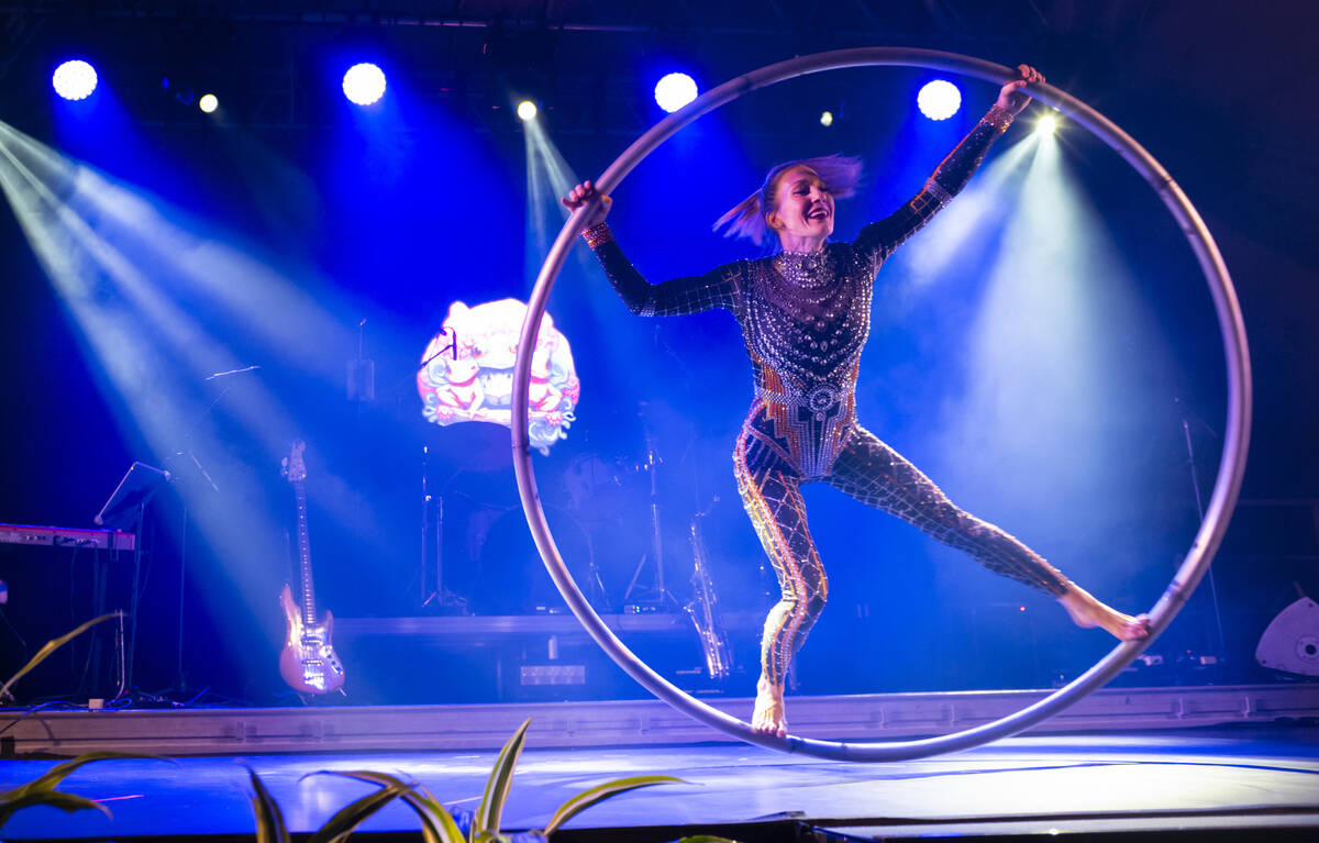 A performer on a cyr wheel entertains the crowd at Frooog’s Camp House on Hacienda, outside o ...