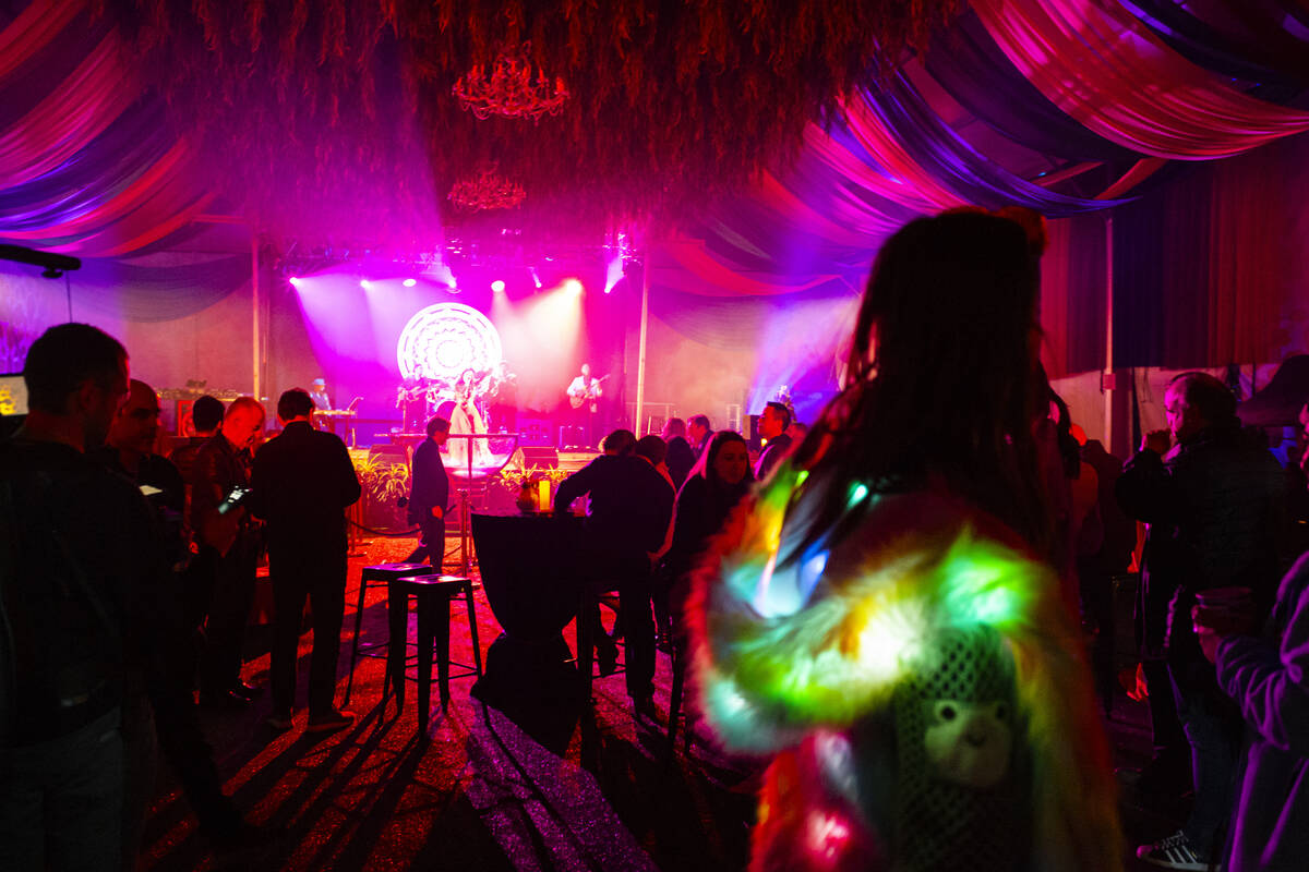 Attendees mingle at Frooog’s Camp House on Hacienda, outside of the Luxor, on Wednesday, Feb. ...