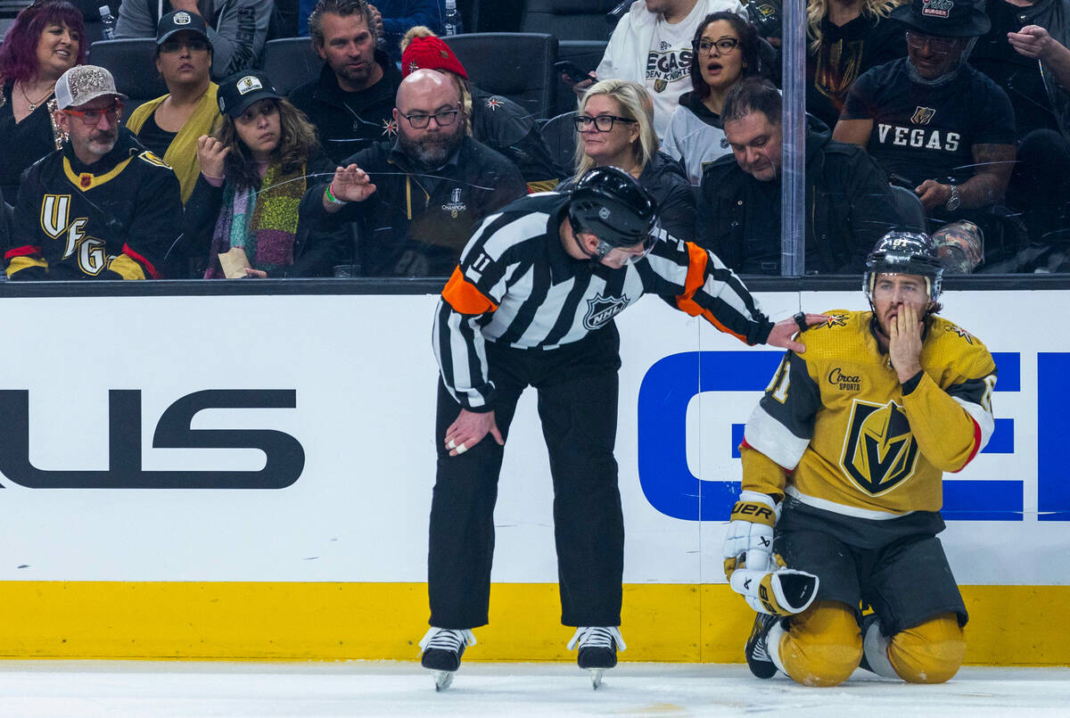 Golden Knights right wing Jonathan Marchessault (81) is checked for a a skate to the face again ...