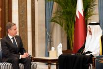 US Secretary of State Antony Blinken, left, meets with Qatar's Amir Sheikh Tamim bin Hamad Al T ...