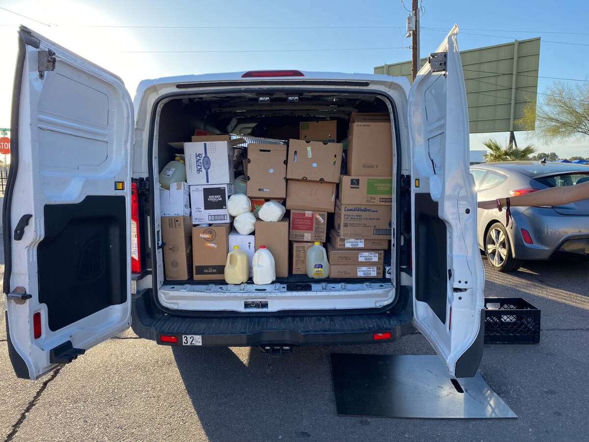 A Food Recovery Network van is filled with leftover food from the 2023 Super Bowl in Glendale, ...