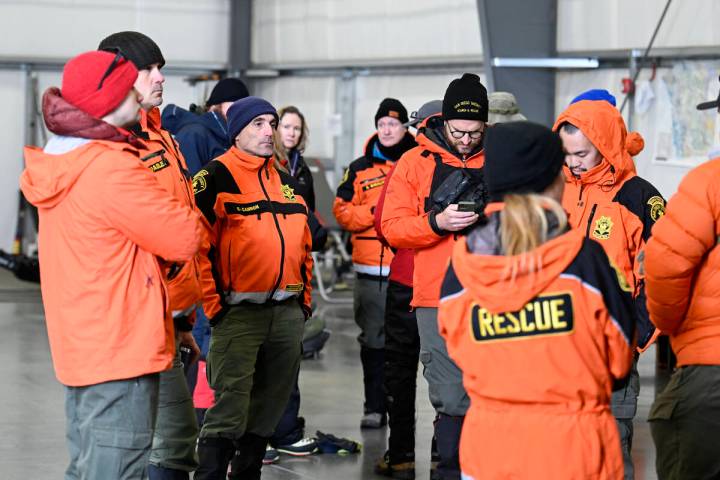 Rescue personnel meet at a command center, Wednesday, Feb. 7, 2024, in Kitchen Creek, Calif. A ...