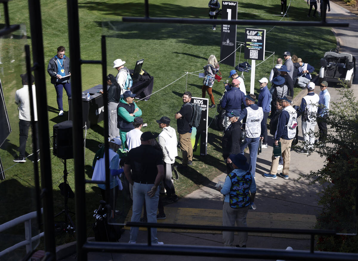 Players and their caddies gather at Las Vegas Country Club during LIV Golf Las Vegas Pro-Am tou ...