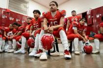 Lahainaluna High School football team players listens to co-head coach Dean Rickard before thei ...