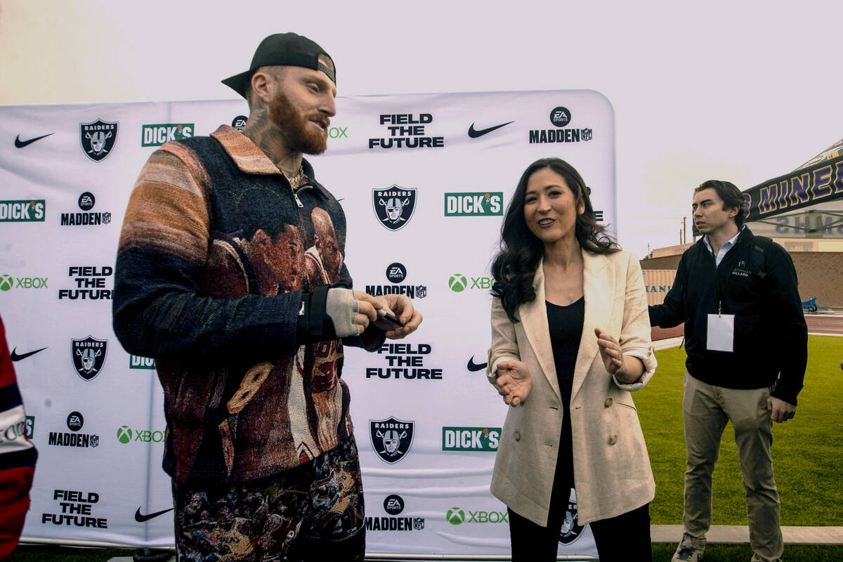 Raiders defensive end Maxx Crosby, left, speaks with ESPN personality Mina Kimes during the Fie ...