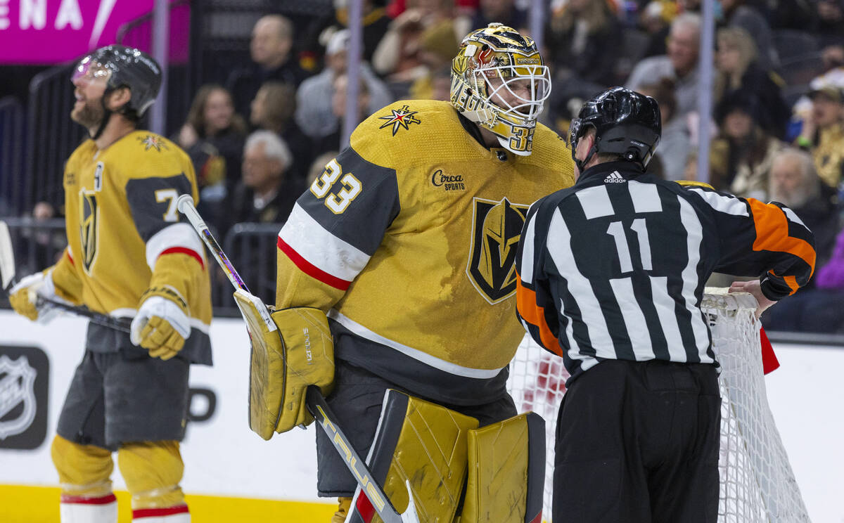 Golden Knights goaltender Adin Hill (33) chats with a referee after a stop against the Edmonton ...