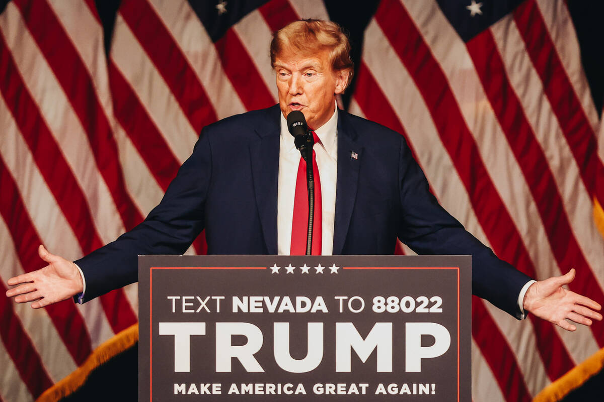 Former President Donald Trump speaks to a crowd at a caucus night watch party hosted by the Tru ...
