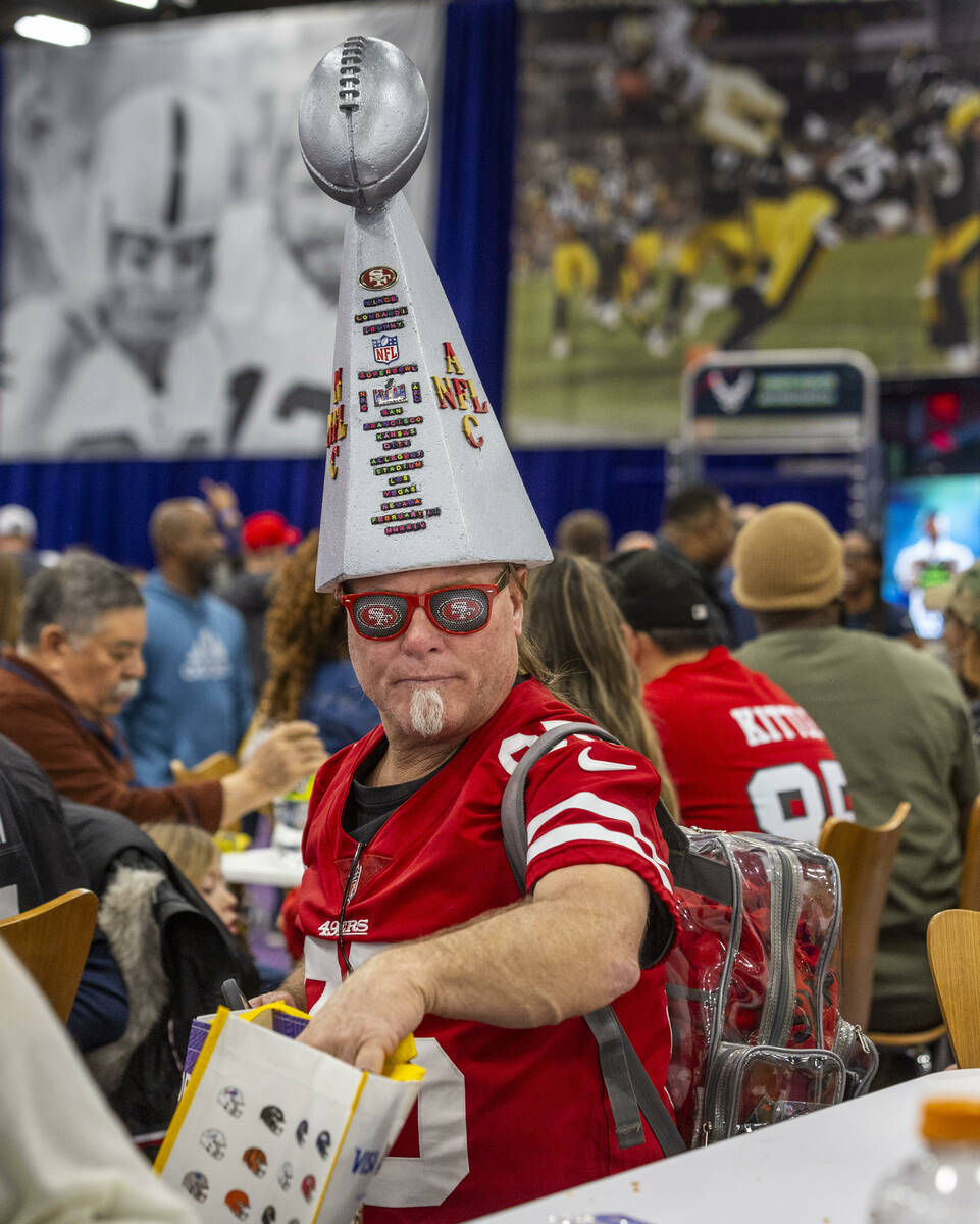 Vic Claveau of California sports his homemade Lombardi Trophy hat during the Super Bowl Experie ...
