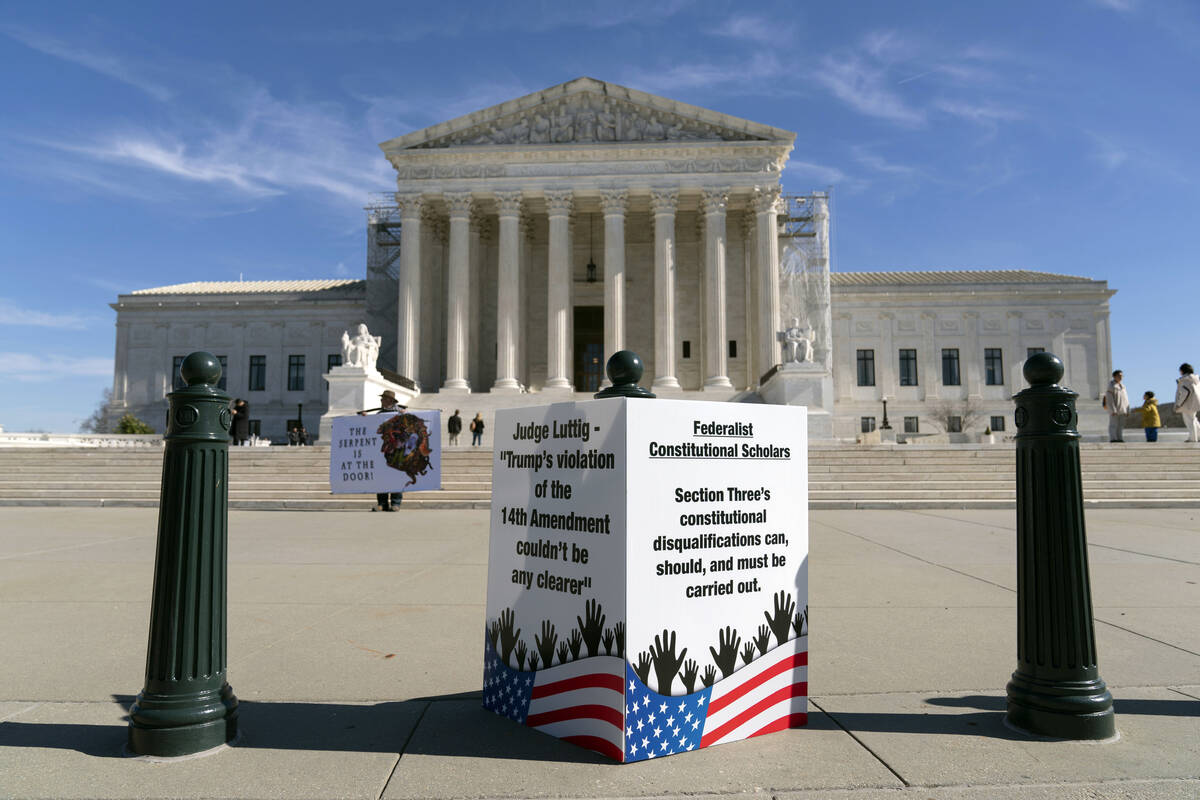 People protest outside of the U.S. Supreme Court Wednesday, Feb. 7, 2024, in Washington. (AP Ph ...