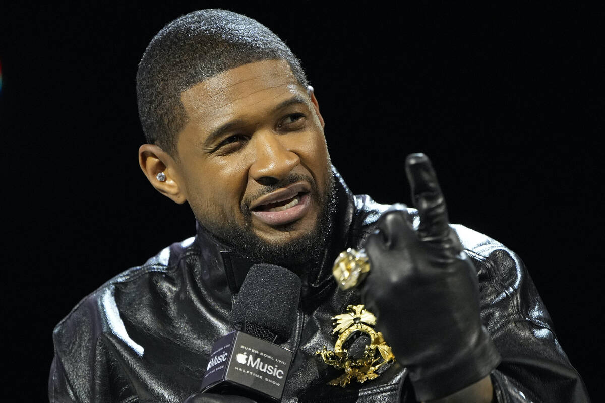 Usher speaks during a news conference ahead of the Super Bowl 58 NFL football game Thursday, Fe ...