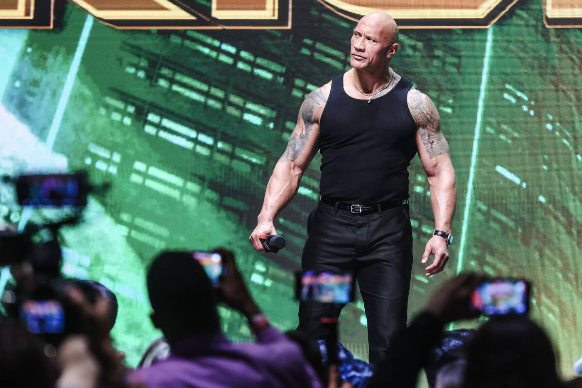 Dwayne “The Rock” Johnson appears on stage at a press conference for WrestleMania ...