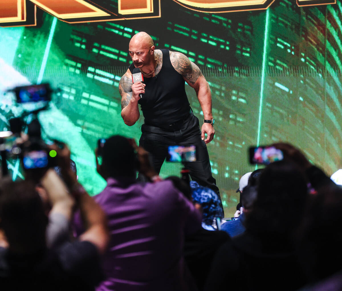Dwayne “The Rock” Johnson appears on stage at a press conference for WrestleMania ...