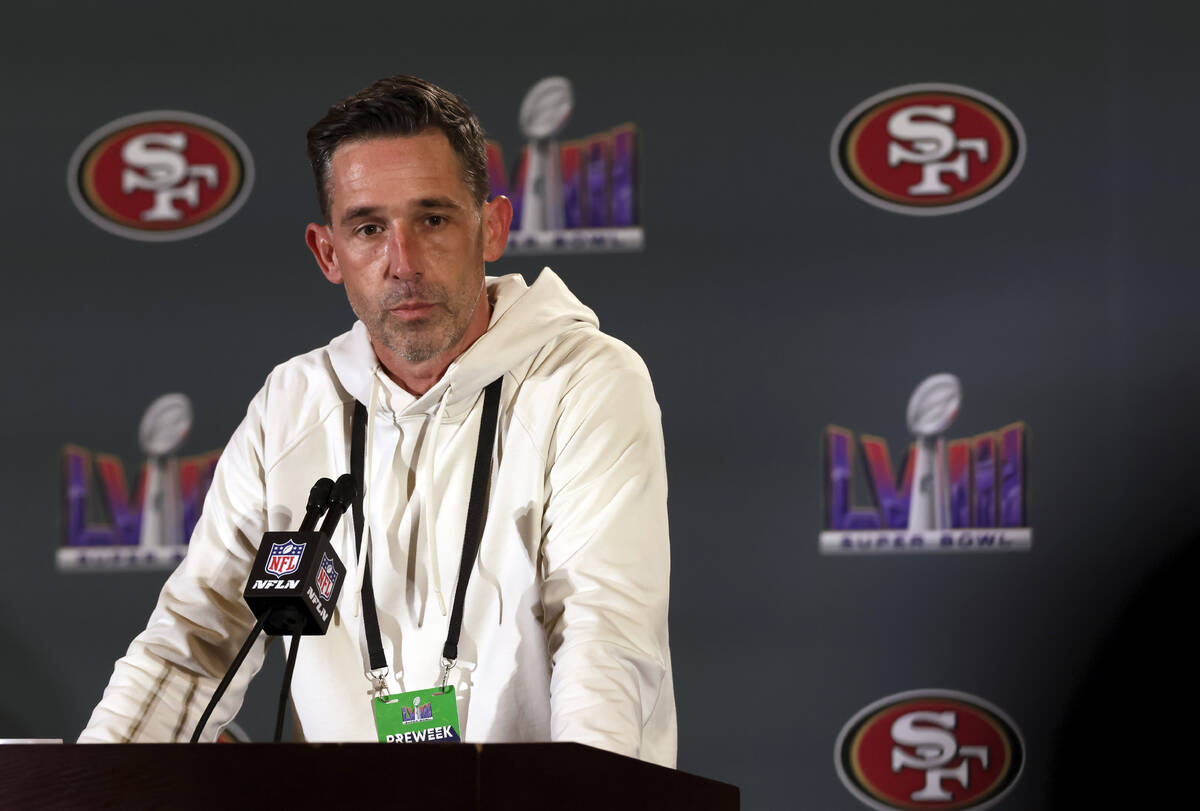 San Francisco 49ers head coach Kyle Shanahan listens to a reporter's question during a news con ...