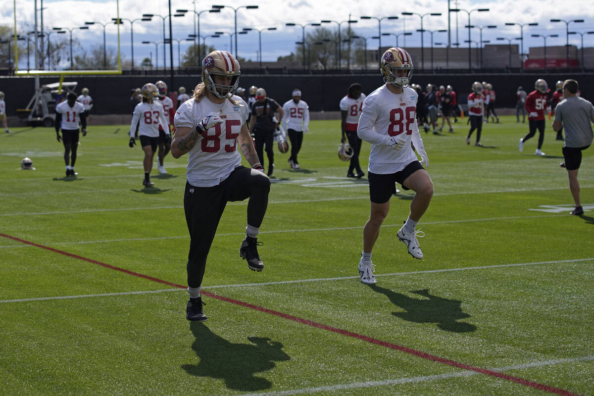 San Francisco 49ers tight ends George Kittle (85) and Jake Tonges (88) warm up during practice ...