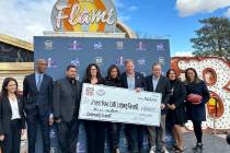 NFL Commissioner Roger Goodell (center) joins members of the Las Vegas Super Bowl Host Committe ...