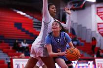 Centennial’s Trysta Barrett (5) is guarded by Liberty’s Daisha Peavy (12) during ...