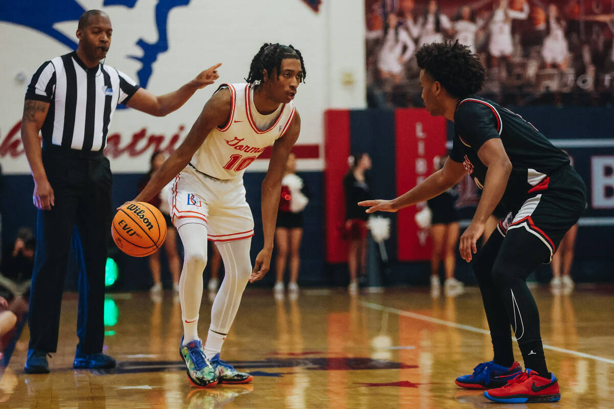Bishop Gorman point guard Nick Jefferson (10) dribbles the ball during a game between Bishop Go ...