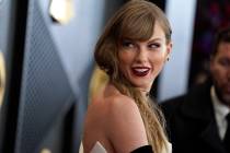 Taylor Swift arrives at the 66th annual Grammy Awards on Sunday, Feb. 4, 2024, in Los Angeles. ...