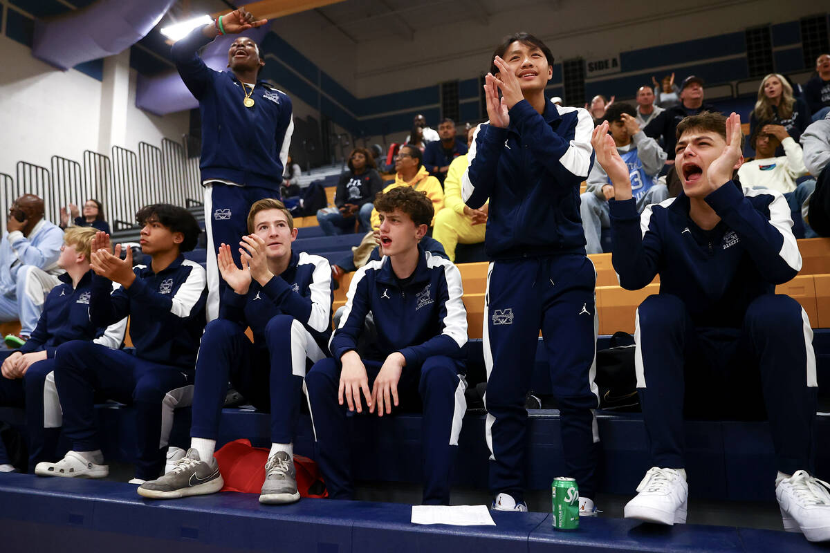 Shadow Ridge’s junior varsity team cheers for varsity during a Class 4A first round play ...